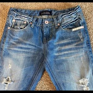 Viva Colour distressed flare jeans.